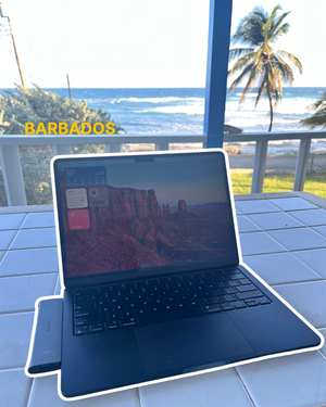 Digital nomad work setup with laptop in sunny Barbados accommodation