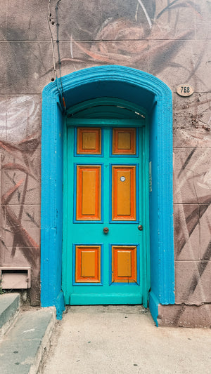 Digital nomads travelling through Valparaiso, Chile. Couple travel, slow travel, working remotely, vegan travel, budget travel. Street art.