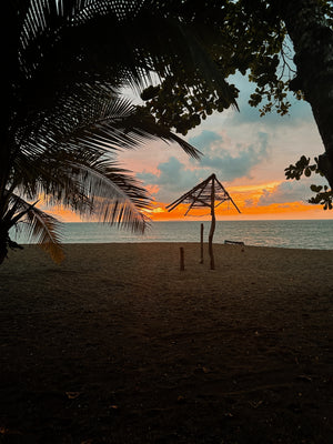 Digital nomads watching sunset in Drake's Bay Costa Rica overlooking Pacific Coast from Osa Peninsula