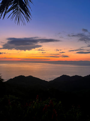 Digital nomads observing sunset in Jaco Costa Rica from public viewpoint slow travel