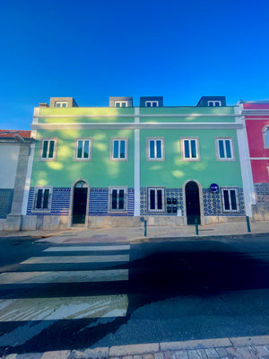 Beautiful and colourful green and pink building in Cascais Portugal