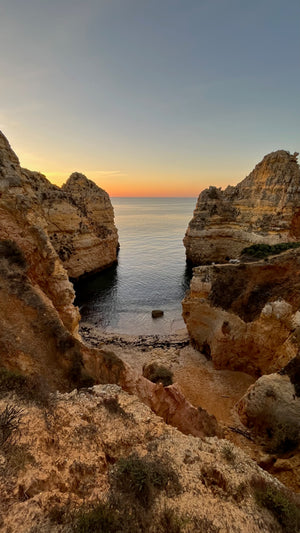 Beautiful rock formations on beach in Lagos Portugal (Ponta da Piedade) during morning trail run and hike