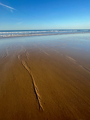 Stunning sand patterns on the beach in Quarteira Portugal during morning walk run Praia da Falésia