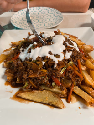 Delicious vegan estrella with Seitan at Estrella Negra in San Pedro de Atacama in Chile loaded fries plant-based
