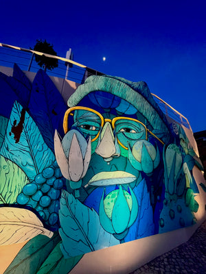 Blue Street art seen in Cascais Portugal marina during morning walk run