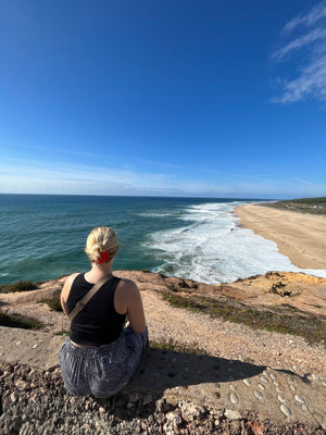 Overlooking Praia do Norte in Nazare Portugal during slow travel digital nomads