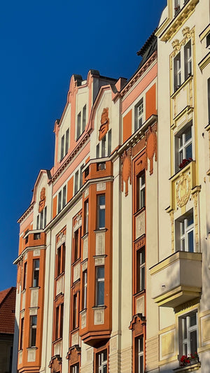 Beautiful Prague architecture with red orange and yellow building with historic and heritage significance